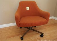 Front view of chair showing upholstery and metal base