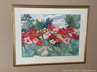 Frontal view of framed watercolor painting depicting poppy field