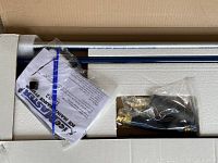 Packaging insert with chrome tubes and bagged components including valve, hose, handle grip