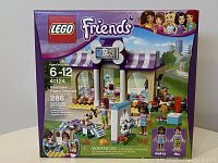 Front of the sealed LEGO Friends Heartlake Puppy Daycare box 41124 showing age range, piece count, and set artwork