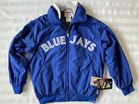 Full front view of blue Blue Jays fleece lined youth jacket with tags attached, showing embroidered Blue Jays lettering and zippered front.