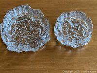 Overhead view of both bowls showing textured bottoms and bark-like ridged sides.