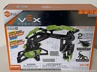 Front view of new HEXBUG VEX Robotics Robotic Arm box showing main product branding, images of the robotic arm, and features such as 66 pieces, age 8+, STEM building kit.