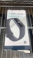 Front of the Fitbit Charge 3 box showing the device image and size S/P L/C label