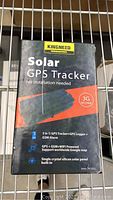 Box packaging of Kingneed Solar GPS Tracker showing key features like 3G WCDMA, GPS+GSM+WiFi powered, single crystal silicon solar panel.