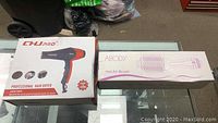 Both items boxed: CHU Pro professional hair dryer in branded box and Abody hot air brush in branded box