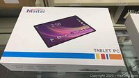 Original Maitai tablet PC box showing the product image and branding.