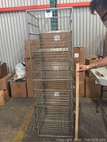 Frontal view of the full 7-drawer wire basket storage unit showing wire basket drawers and metal frame.