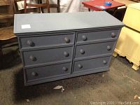 Front view of the blue 6 drawer dresser showing all drawers and top surface.