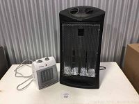 Photo showing both heaters side by side on table.