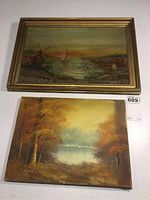 Framed oil on wood painting showing autumn river scene with windmills and sailboat, signed F. Arentzen 1904, above an unframed autumnal landscape oil on canvas signed Eliza