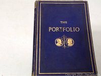 Front cover of The Portfolio volume, blue cloth with gold embossed text and image