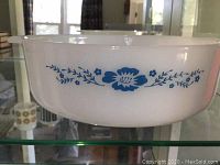Side view of the white mixing bowl showing blue floral pattern.