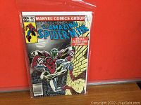 Front cover of Amazing Spider-Man #231 comic with Spider-Man and Cobra characters, sealed in protective sleeve against red background.