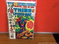 Front cover of the Marvel Two-In-One King-Size Annual comic book enclosed in plastic sleeve against a red background.