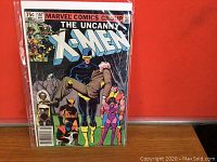 Front cover of The Uncanny X-Men comic issue 167 showing characters and Marvel Comics Group branding.