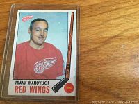 Front of the Frank Mahovlich hockey card showing player in Red Wings jersey, including name and team details.