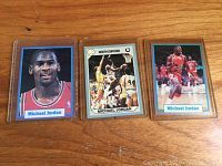 Front view of the trio of Michael Jordan basketball cards, showing the player images and card borders.