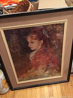 Frontal image of the wood framed artist reproduction showing the young girl portrait in a black and beige frame.