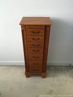 Front view of closed jewelry armoire