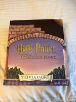 Front of the Harry Potter and the Sorcerer's Stone Trivia Game box showing title and themed artwork