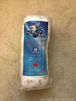 Photo of new unopened MyPillow still in original plastic packaging showing branding with 10-year guarantee.