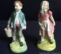 Front view of Jack and Jill Royal Doulton bone china figurines showing details and coloring.