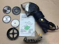 Full layout of the multi-cutter saw, blades, accessories, and owner's manual