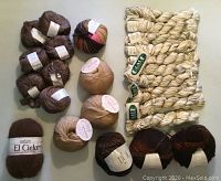 Photo showing grouping of yarn balls from various brands and colors in taupe, brown, oatmeal and natural blends