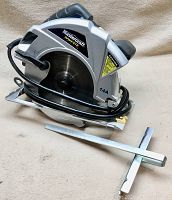 Photo of Mastercraft 7 1/4 inch circular saw with laser guide attachment, showing side view of saw and cord.