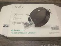 Box of Eufy RoboVac 11+ robotic vacuum cleaner showing the product image, branding, and key features.
