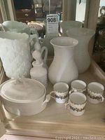 Front view of entire lot showing all items on tray with mirror background