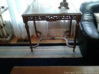 Full front view of gilded parlor table showing overall style and condition