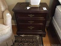 Pair of mahogany nightstands side by side showing top view and drawer fronts