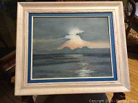 Framed acrylic painting showing full artwork and frame with blue and cream mats.