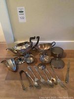 Overall view of assorted sterling silver items on floor