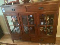 Full front view of hutch showing drawers and glass doors