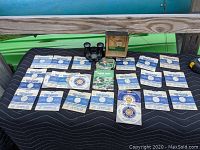 Top view showing the viewer and 20 reels laid out on a surface.