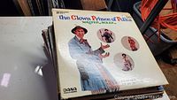 Close-up of the vinyl record album cover for The Clown Prince of Polka by Walter Solek showing detailed artwork and text.