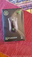 Front of the retail box revealing Razer DeathAdder Elite gaming mouse with 5G optical sensor marking.