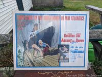 Full view of the Assault on a Queen half sheet movie poster with illustrated action scene and title text.