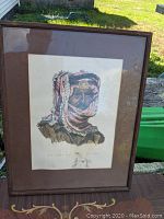 Framed artwork view showing the entire print in its frame with traditional Middle Eastern attire portrait.