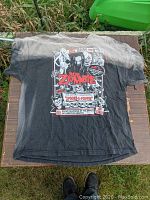 Full front view of vintage Rob Zombie Spooks-A-Poppin t-shirt laid flat showing faded black to gray fabric with detailed horror-themed graphic.
