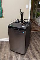 Front view of cooler with dispensing tower on top