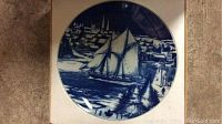 Front of Goebel 'The Bluenose' collector plate featuring a sailing ship and harbor scene in blue and white.