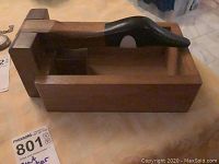 Top and side view of wooden nutcracker shaped like Canadian goose, showing the body and neck lever mechanism.