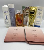 All bath and body care products including shampoos, lotions, hand creams, conditioner and masks displayed together on a white surface.