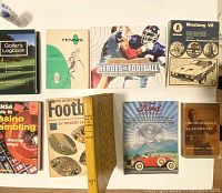 Top down view of sports and cars books collection showing titles and cover designs