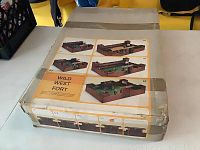 Top view of original box showing assembled wooden Fort Wyoming playset with images of all angles and accessories.