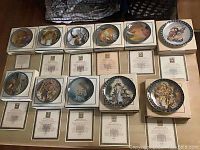 All 11 Konigszelt Bayern collector plates in original boxes with certificates of authenticity underneath.
